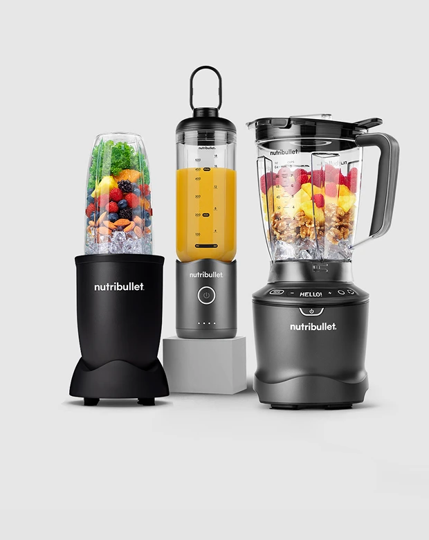 A lineup of personal, full-sized, immersion, and portable Nutribullet blenders on display.
