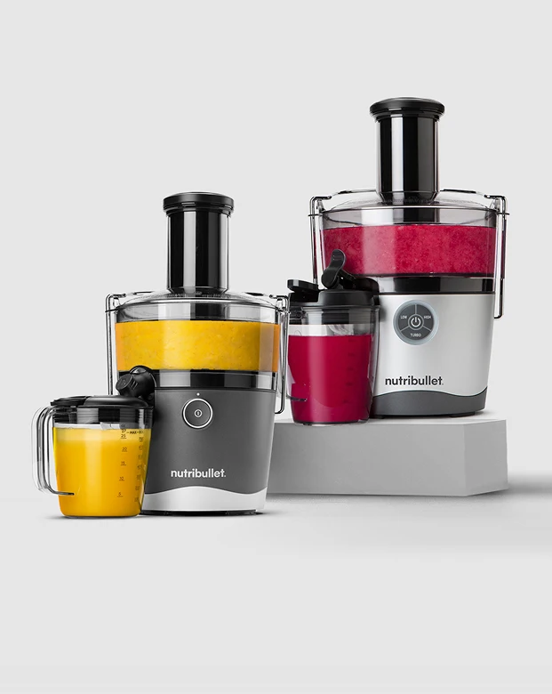 nutribullet centrifugal juicers shown with colorful fresh juice and fruits.