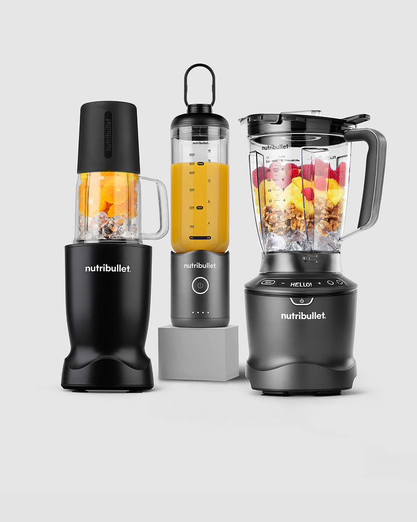 A lineup of personal, full-sized, immersion, and portable Nutribullet blenders on display.