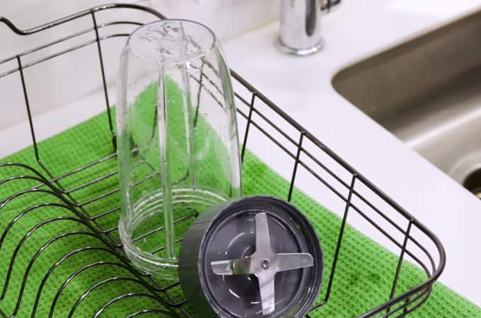 Cup and Blade attachment next to sink in a drying rack